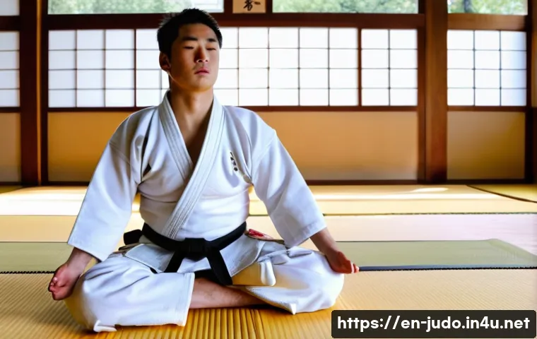 유도 훈련 중 호흡 관리 - A focused young male judoka wearing a white judogi practicing diaphragmatic breathing during warm-up...